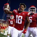 PISCATAWAY, NJ - AUGUST 30: Bo Melton #18 of the Rutgers Scarlet Knights celebrates a touchdown with teammate Mohamed Jabbie #6 against the Massachusetts Minutemen during the second quarter at SHI Stadium on August 30, 2019 in Piscataway, New Jersey. (Photo by Corey Perrine/Getty Images)