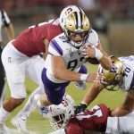 PALO ALTO, CALIFORNIA - OCTOBER 05: Cade Otton #87 of the Washington Huskies gets forced out of bounds by Curtis Robinson #2 of the Stanford Cardinal during the second quarter of an NCAA football game at Stanford Stadium on October 05, 2019 in Palo Alto, California. (Photo by Thearon W. Henderson/Getty Images)