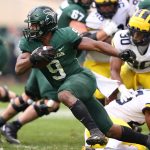 EAST LANSING, MICHIGAN - OCTOBER 30: Kenneth Walker III #9 of the Michigan State Spartans looks for yards while playing the Michigan Wolverines during the second half at Spartan Stadium on October 30, 2021 in East Lansing, Michigan. (Photo by Gregory Shamus/Getty Images)