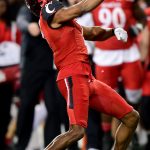 CINCINNATI, OHIO - DECEMBER 04: Coby Bryant #7 of the Cincinnati Bearcats celebrates an interception during the second half of the 2021 American Conference Championship against the Houston Cougars at Nippert Stadium on December 04, 2021 in Cincinnati, Ohio. (Photo by Emilee Chinn/Getty Images)