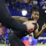 INDIANAPOLIS, INDIANA - MARCH 05: Tyreke Smith #DL42 of Ohio State runs a drill during the NFL Combine at Lucas Oil Stadium on March 05, 2022 in Indianapolis, Indiana. (Photo by Justin Casterline/Getty Images)