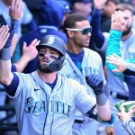 CHICAGO, ILLINOIS - APRIL 14: Mitch Haniger #17 of the Seattle Mariners celebrates in the dugout with teammates after his two-run home run in the eighth inning against the Seattle Mariners at Guaranteed Rate Field on April 14, 2022 in Chicago, Illinois. (Photo by Quinn Harris/Getty Images)