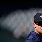 SEATTLE, WASHINGTON - APRIL 15: Jarred Kelenic #10 of the Seattle Mariners looks on before the game against the Houston Astros at T-Mobile Park on April 15, 2022 in Seattle, Washington. All players are wearing the number 42 in honor of Jackie Robinson Day. (Photo by Steph Chambers/Getty Images)