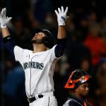 SEATTLE, WASHINGTON - APRIL 15: Eugenio Suarez #28 of the Seattle Mariners celebrates his two-run home run during the eighth inning against the Houston Astros at T-Mobile Park on April 15, 2022 in Seattle, Washington. All players are wearing the number 42 in honor of Jackie Robinson Day. (Photo by Steph Chambers/Getty Images)