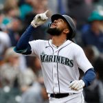SEATTLE, WASHINGTON - APRIL 23: J.P. Crawford #3 of the Seattle Mariners celebrates his two run home run against the Kansas City Royals during the first inning at T-Mobile Park on April 23, 2022 in Seattle, Washington. (Photo by Steph Chambers/Getty Images)