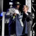 LAS VEGAS, NEVADA - APRIL 28: (L-R) Charles Cross poses with NFL Commissioner Roger Goodell onstage after being selected ninth by the Seattle Seahawks during round one of the 2022 NFL Draft on April 28, 2022 in Las Vegas, Nevada. (Photo by David Becker/Getty Images)