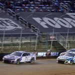 
              Driver Daniel Suarez (99) leads Ross Chastain (1), Kyle Busch (18) during a NASCAR Cup Series auto race, Sunday, April 17, 2022, in Bristol, Tenn. (AP Photo/Wade Payne)
            