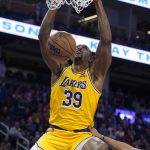 
              Los Angeles Lakers center Dwight Howard (39) dunks against the Golden State Warriors during the first half of an NBA basketball game in San Francisco, Thursday, April 7, 2022. (AP Photo/Jeff Chiu)
            