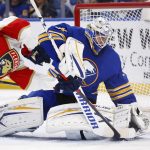 
              Buffalo Sabres goaltender Dustin Tokarski (31) stops Florida Panthers center Eetu Luostarinen (27) during the second period of an NHL hockey game, Sunday, April 3, 2022, in Buffalo, N.Y. (AP Photo/Jeffrey T. Barnes)
            