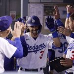 
              Los Angeles Dodgers' Chris Taylor is congratulated by teammates in the dugout after hitting a solo home run during the second inning of a baseball game against the Detroit Tigers Friday, April 29, 2022, in Los Angeles. (AP Photo/Mark J. Terrill)
            