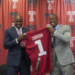 
              FILE - Arthur Johnson, left, the new Athletic Director at Temple University, and Temple University President Jason Wingard, right, pose during an introductory press conference in Philadelphia, Thursday, Oct. 7, 2021. Temple is also the only school among 131 that compete at the highest level of Division I to have Black people leading the university, the athletic department, the football program and both the men's and women's basketball programs. (Thomas Hengge/The Philadelphia Inquirer via AP, File)
            