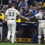 
              Milwaukee Brewers starting pitcher Brandon Woodruff (53) reacts with Brewers catcher Omar Narvaez (10) after the sixth inning against the Pittsburgh Pirates during a baseball game Wednesday, April 20, 2022, in Milwaukee. (AP Photo/Jeffrey Phelps)
            