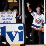 
              FILE - Hockey Hall of Famer and former New York Islander Mike Bossy waves to fans as he is introduced before the NHL hockey game between the Islanders and the Boston Bruins at Nassau Coliseum on Thursday, Jan. 29, 2015, in Uniondale, N.Y. Bossy dropped a ceremonial first puck. Bossy, one of hockey’s most prolific goal-scorers and a star for the New York Islanders during their 1980s dynasty, died Thursday, April 14, 2022, after a battle with lung cancer. He was 65. (AP Photo/Kathy Kmonicek, File)
            