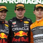 
              Red Bull driver Max Verstappen, center, of the Netherlands, winner of the Emilia Romagna Formula One Grand Prix, celebrates on the podium with second placed Red Bull driver Sergio Perez, left, of Mexico, and third placed McLaren driver Lando Norris, of Britain, at the Enzo and Dino Ferrari racetrack, in Imola, Italy, Sunday, April 24, 2022. (AP Photo/Luca Bruno)
            