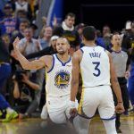 
              Golden State Warriors guard Stephen Curry (30) is congratulated by guard Jordan Poole (3) after scoring against the Denver Nuggets during the first half of Game 2 of an NBA basketball first-round playoff series in San Francisco, Monday, April 18, 2022. (AP Photo/Jeff Chiu)
            