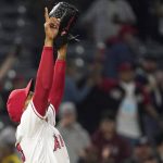 
              Los Angeles Angels relief pitcher Raisel Iglesias gestures after the Angels defeated the Cleveland Guardians in a baseball game Tuesday, April 26, 2022, in Anaheim, Calif. (AP Photo/Mark J. Terrill)
            
