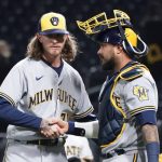 
              Milwaukee Brewers relief pitcher Josh Hader, left, is greeted by Bryan Reynolds after the team's 3-1 win over Pittsburgh Pirates in a baseball game Wednesday, April 27, 2022, in Pittsburgh. (AP Photo/Keith Srakocic)
            