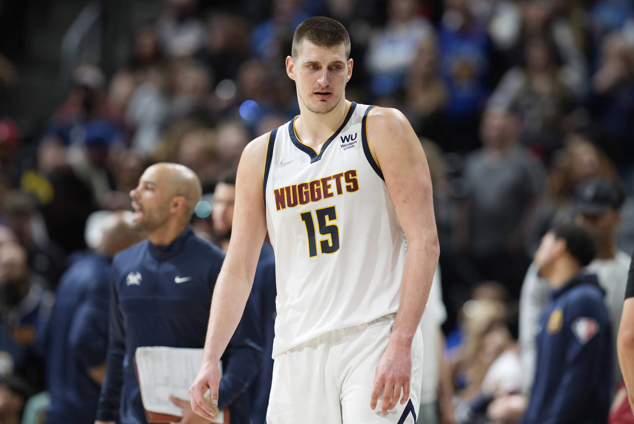 Denver Nuggets center Nikola Jokic looks on as time runs out in the second half of an NBA basketbal...