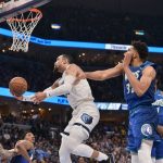 
              Memphis Grizzlies forward Dillon Brooks (24) shoots ahead of Minnesota Timberwolves center Karl-Anthony Towns (32) during the first half of Game 1 of a first-round NBA basketball playoff series Saturday, April 16, 2022, in Memphis, Tenn. (AP Photo/Brandon Dill)
            