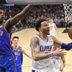
              Los Angeles Clippers guard Amir Coffey, right, shoots as Oklahoma City Thunder forward Jaylen Hoard defends during the second half of an NBA basketball game Sunday, April 10, 2022, in Los Angeles. (AP Photo/Mark J. Terrill)
            