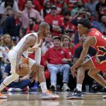 
              Phoenix Suns guard Chris Paul, left, works against New Orleans Pelicans forward Herbert Jones (5) in the first half of Game 3 of an NBA basketball first-round playoff series in New Orleans, Friday, April 22, 2022. (AP Photo/Michael DeMocker)
            
