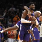
              Phoenix Suns center Deandre Ayton (22) and forward Torrey Craig (0) react after a score against the Los Angeles Lakers during the second half of an NBA basketball game Tuesday, April 5, 2022, in Phoenix. The Suns won 121-110. (AP Photo/Rick Scuteri)
            