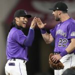 
              Colorado Rockies first baseman Connor Joe, left, celebrates with center fielder Sam Hilliard after the ninth inning of a baseball game against the Los Angeles Dodgers Saturday, April 9, 2022, in Denver. (AP Photo/David Zalubowski)
            