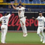 
              Tampa Bay Rays left fielder Brett Phillips, center, celebrates with shortstop Wander Franco, left, and center fielder Kevin Kiermaier, right, after the team defeated the Seattle Mariners during a baseball game Thursday, April 28, 2022, in St. Petersburg, Fla. (AP Photo/Chris O'Meara)
            