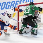 
              New York Islanders defenseman Grant Hutton (7) helps goaltender Semyon Varlamov (40) defend against a shot by Dallas Stars left wing Marian Studenic (43) during the third period of an NHL hockey game Tuesday, April 5, 2022, in Dallas. (AP Photo/Tony Gutierrez)
            