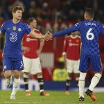
              Chelsea's Marcos Alonso, left, celebrates with his teammate Thiago Silva after scoring his side's first goal during the English Premier League soccer match between Manchester United and Chelsea, at Old Trafford Stadium, Manchester, England, Thursday, April, 2022. (AP Photo/Dave Thompson)
            