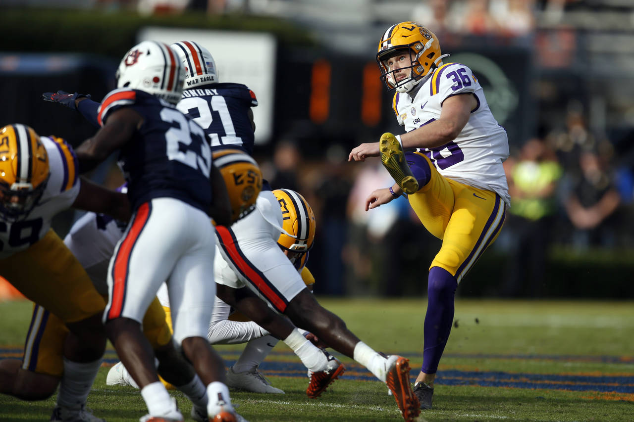 FILE - LSU kicker Cade York (36) boots a field goal during the second quarter of an NCAA college fo...