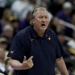 
              FILE - West Virginia coach Bob Huggins talks to players during the first half of the team's NCAA college basketball game against Kansas State in the first round of the Big 12 Conference tournament in Kansas City, Mo., Wednesday, March 9, 2022. NBA stars Manu Ginobili and Tim Hardaway are among five new  Basketball Hall of Fame inductees. Also selected this year were Huggins, WNBA great Swin Cash, former NBA coach George Karl. They will be enshrined into the Naismith Memorial Basketball Hall of Fame in Springfield, Massachusetts, on Sept. 10, 2022.  (AP Photo/Charlie Riedel, File)
            