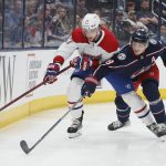
              Montreal Canadiens' Josh Anderson, left, and Columbus Blue Jackets' Zach Werenski chase the puck during the first period of an NHL hockey game Wednesday, April 13, 2022, in Columbus, Ohio. (AP Photo/Jay LaPrete)
            