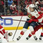 
              Florida Panthers left wing Mason Marchment (17) controls the puck next to Detroit Red Wings defenseman Filip Hronek (17) during the first period of an NHL hockey game, Sunday, April 17, 2022, in Detroit. (AP Photo/Carlos Osorio)
            