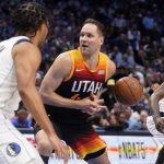 
              Utah Jazz forward Bojan Bogdanovic, center, loses control of the ball as Dallas Mavericks' Jalen Brunson, left, and Dorian Finney-Smith, right, defend in the first half of Game 2 of an NBA basketball first-round playoff series, Monday, April 18, 2022, in Dallas. (AP Photo/Tony Gutierrez)
            