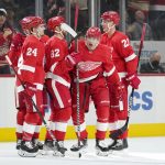
              Detroit Red Wings left wing Jakub Vrana, second from right, celebrates his goal against the Columbus Blue Jackets in the second period of an NHL hockey game Saturday, April 9, 2022, in Detroit. (AP Photo/Paul Sancya)
            