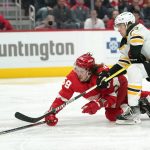 
              Boston Bruins defenseman Charlie McAvoy (73) defends Detroit Red Wings left wing Tyler Bertuzzi (59) in the second period of an NHL hockey game Tuesday, April 5, 2022, in Detroit. (AP Photo/Paul Sancya)
            