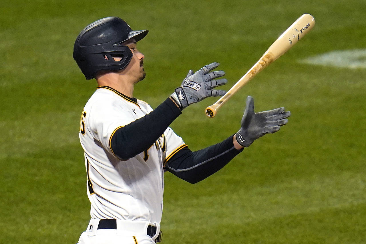 Pittsburgh Pirates' Bryan Reynolds lets go of his bat after swinging at a pitch from Washington Nat...