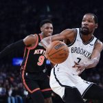 
              Brooklyn Nets' Kevin Durant (7) passes the ball away from New York Knicks' RJ Barrett (9) during the first half of an NBA basketball game Wednesday, April 6, 2022, in New York. (AP Photo/Frank Franklin II)
            