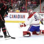 
              Ottawa Senators centre Josh Norris (9) scores on Montreal Canadiens goaltender Carey Price (31) during the second period of an NHL hockey game Saturday, April 23, 2022, in Ottawa, Ontario. (Justin Tang/The Canadian Press via AP)
            