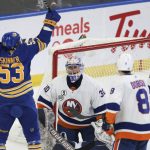 
              Buffalo Sabres left wing Jeff Skinner (53) celebrates after assisting a goal by right wing Tage Thompson as New York Islanders goaltender Ilya Sorokin (30) looks on during the second period of an NHL hockey game on Saturday, April 23, 2022, in Buffalo, N.Y. (AP Photo/Joshua Bessex)
            
