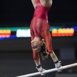 
              Arkansas' Kennedy Hambrick competes on the uneven bars during the NCAA women's gymnastics championships, Thursday, April 14, 2022, in Fort Worth, Texas. (AP Photo/Tony Gutierrez)
            
