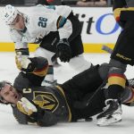 
              Vegas Golden Knights right wing Mark Stone (61) is knocked to the ice by San Jose Sharks right wing Timo Meier (28) during the first period of an NHL hockey game Sunday, April 24, 2022, in Las Vegas. (AP Photo/John Locher)
            