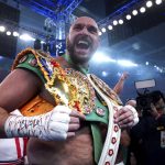 
              Britain’s Tyson Fury celebrates after beating Britain’s Dillian Whyte to win their WBC heavyweight title boxing fight at Wembley Stadium in London, Saturday, April 23, 2022. (Nick Potts/PA via AP)
            