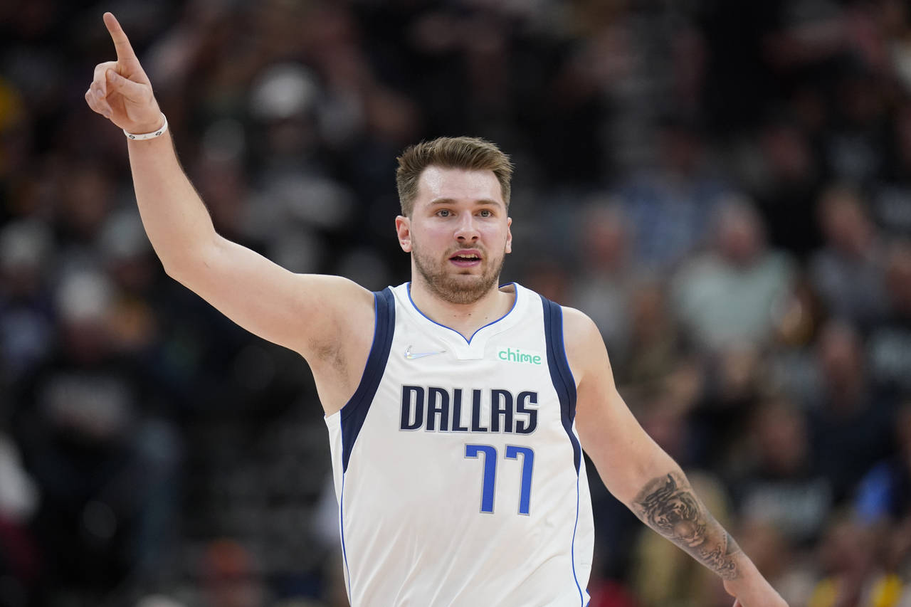 Dallas Mavericks guard Luka Doncic (77) gestures in the second half of Game 6 of an NBA basketball ...
