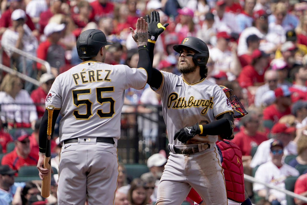 Pittsburgh Pirates' Michael Chavis, right, is congratulated by teammate Roberto Perez (55) after hi...