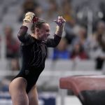 
              Utah's Maile O'Keefe celebrates after competing on the vault during the NCAA women's gymnastics championships, Thursday, April 14, 2022, in Fort Worth, Texas. (AP Photo/Tony Gutierrez)
            