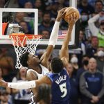 
              Minnesota Timberwolves guard Malik Beasley (5) has his dunk attempt blocked by Memphis Grizzlies forward Jaren Jackson Jr. during the first half of Game 3 of an NBA basketball first-round playoff series Thursday, April 21, 2022, in Minneapolis. (AP Photo/Andy Clayton-King)
            