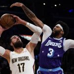 
              Los Angeles Lakers forward Anthony Davis (3) defends against New Orleans Pelicans center Jonas Valanciunas (17) during the first half of an NBA basketball game in Los Angeles, Friday, April 1, 2022. (AP Photo/Ashley Landis)
            