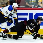 
              St. Louis Blues center Ryan O'Reilly (90) trips Arizona Coyotes center Jack McBain (22) during the first period of an NHL hockey game Saturday, April 23, 2022, in Glendale, Ariz. (AP Photo/Ross D. Franklin)
            